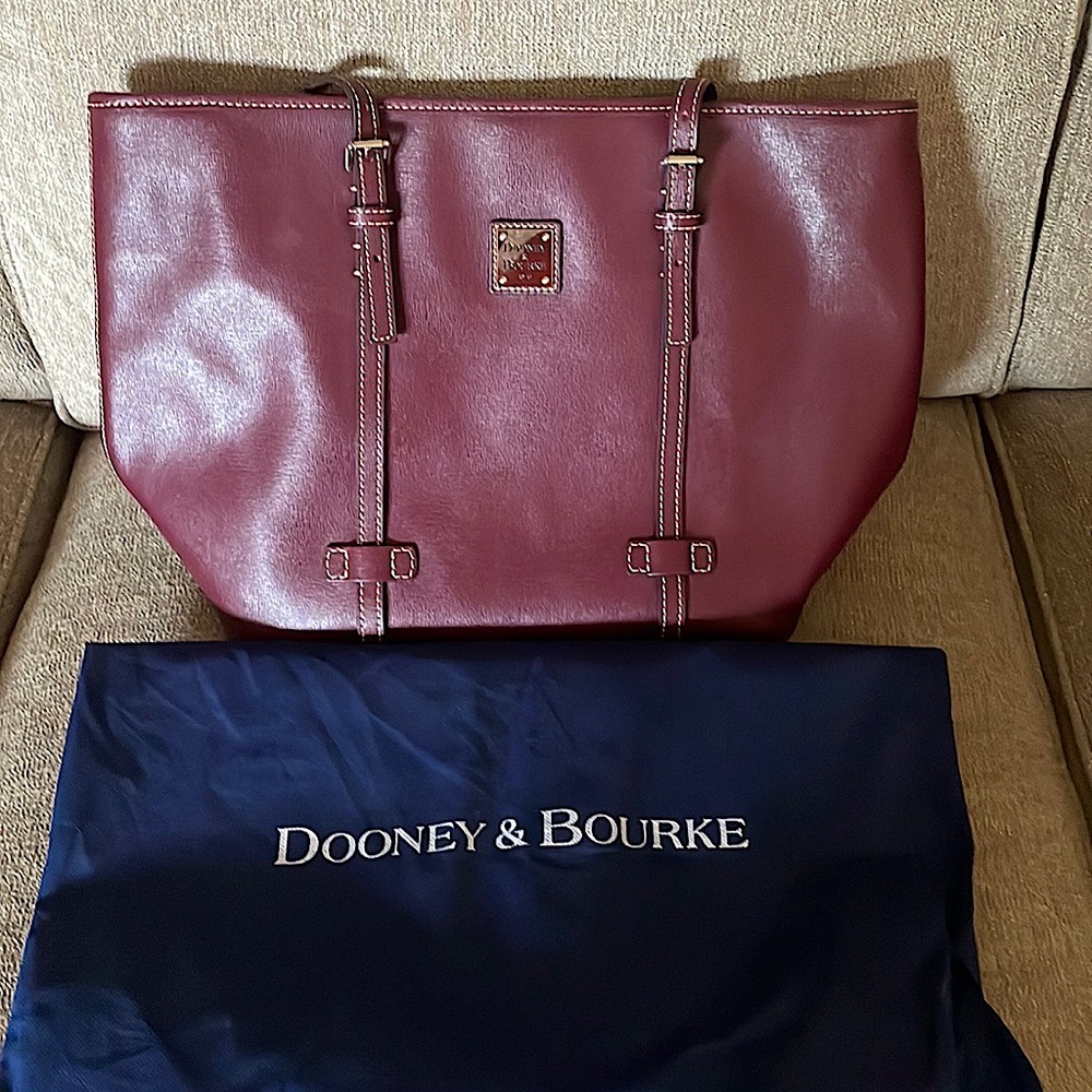 Beautiful burgundy leather.  Carried twice, like new.  Great accessory for fall.